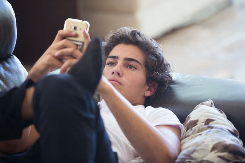 Young person looking at phone