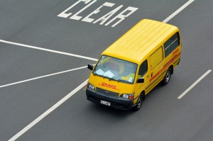 A courier van drives down the road in Auckland
